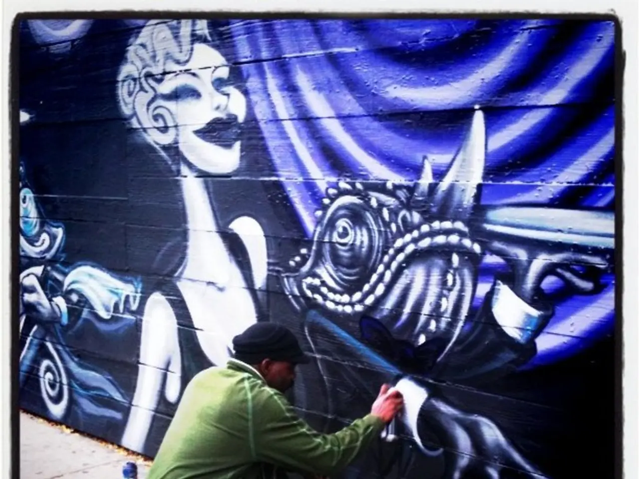 This is a photo and here we can see a person holding a bottle and there are some other bottles on...