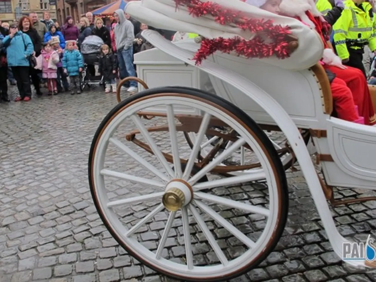 In this image I can see the chart which is in white color. in the cart I can see few people...