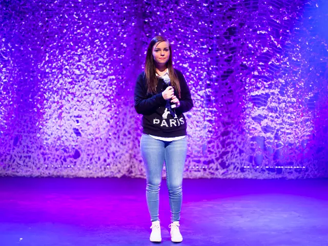 This picture shows a girl standing and she is holding a microphone in her hand and we see lighting...