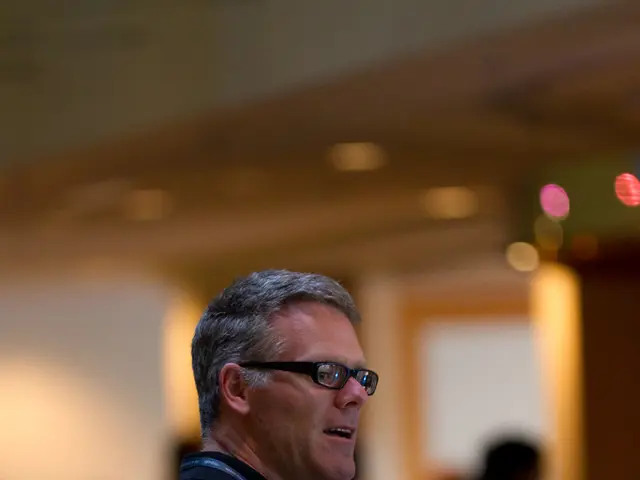 In the image there is a man, he is wearing a backpack and holding a bottle in his hand. He is also...