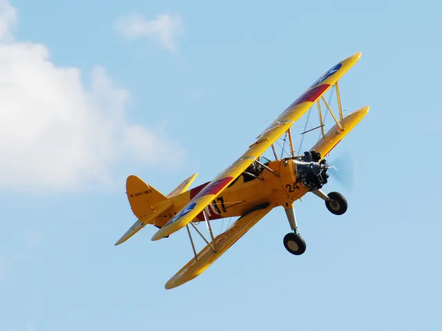 This image consists of an aircraft in the air and the sky. This image is taken may be during a day.