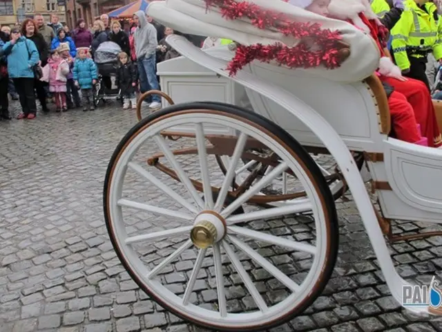 In this image I can see the chart which is in white color. in the cart I can see few people...