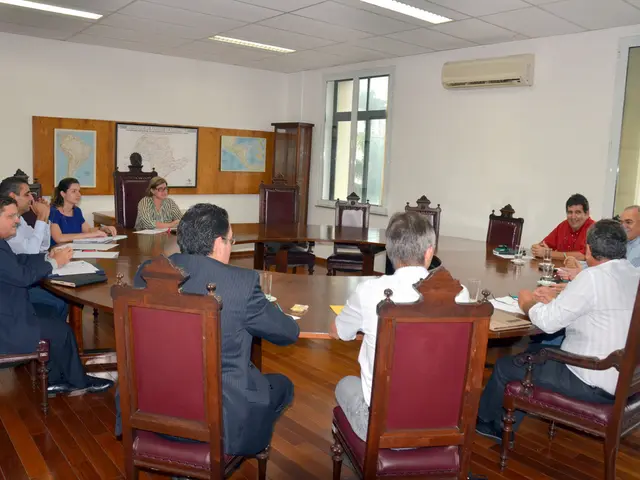 This picture describes about group of people they are all seated on the chair, in front of them we...