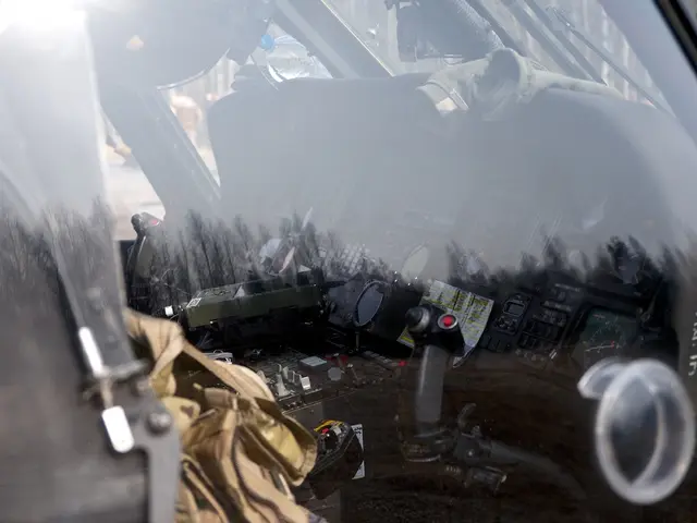 In this image we can see an aircraft which is truncated. Through the glass we can see control...